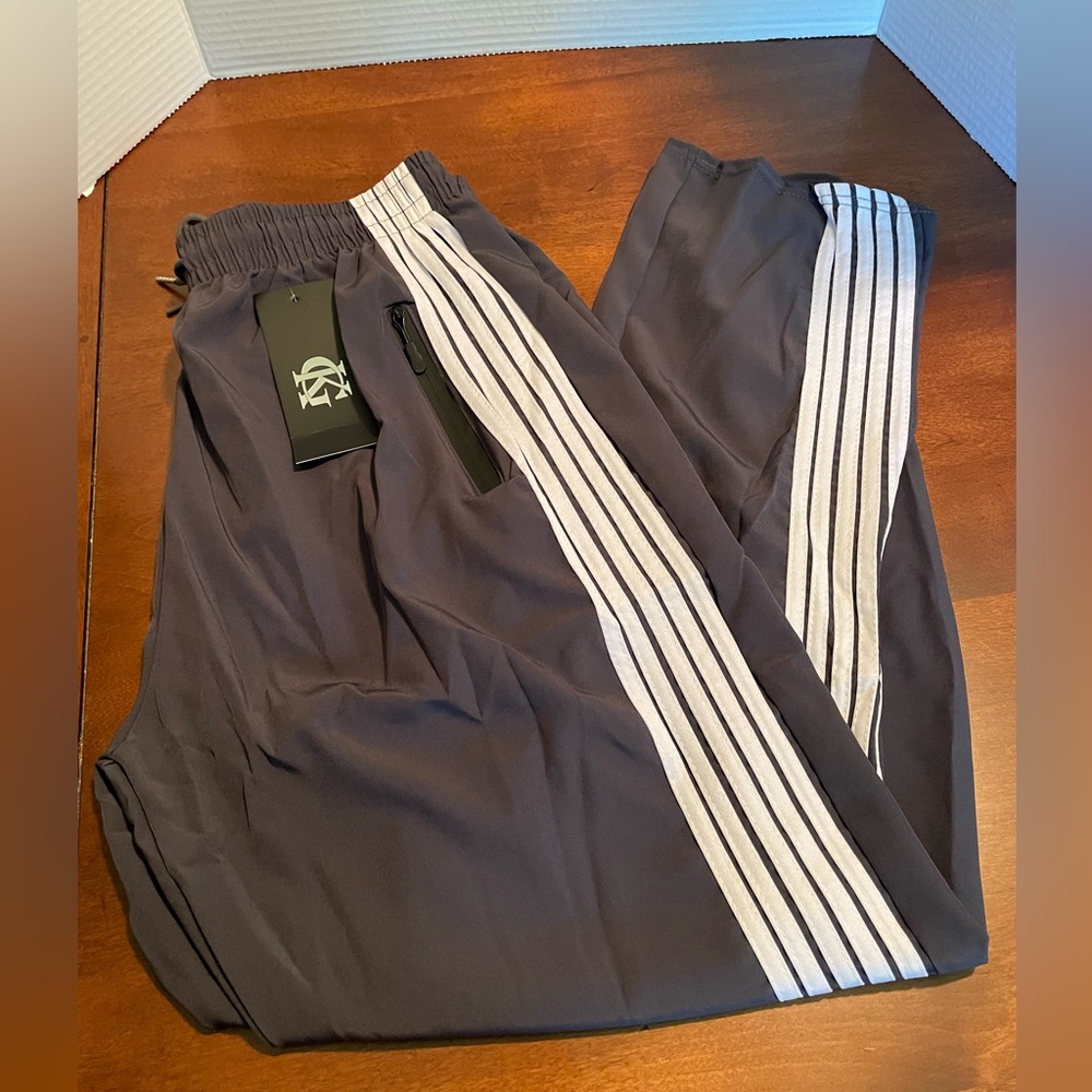 Men’s warmup pants.  Gray with white stripes. NWT